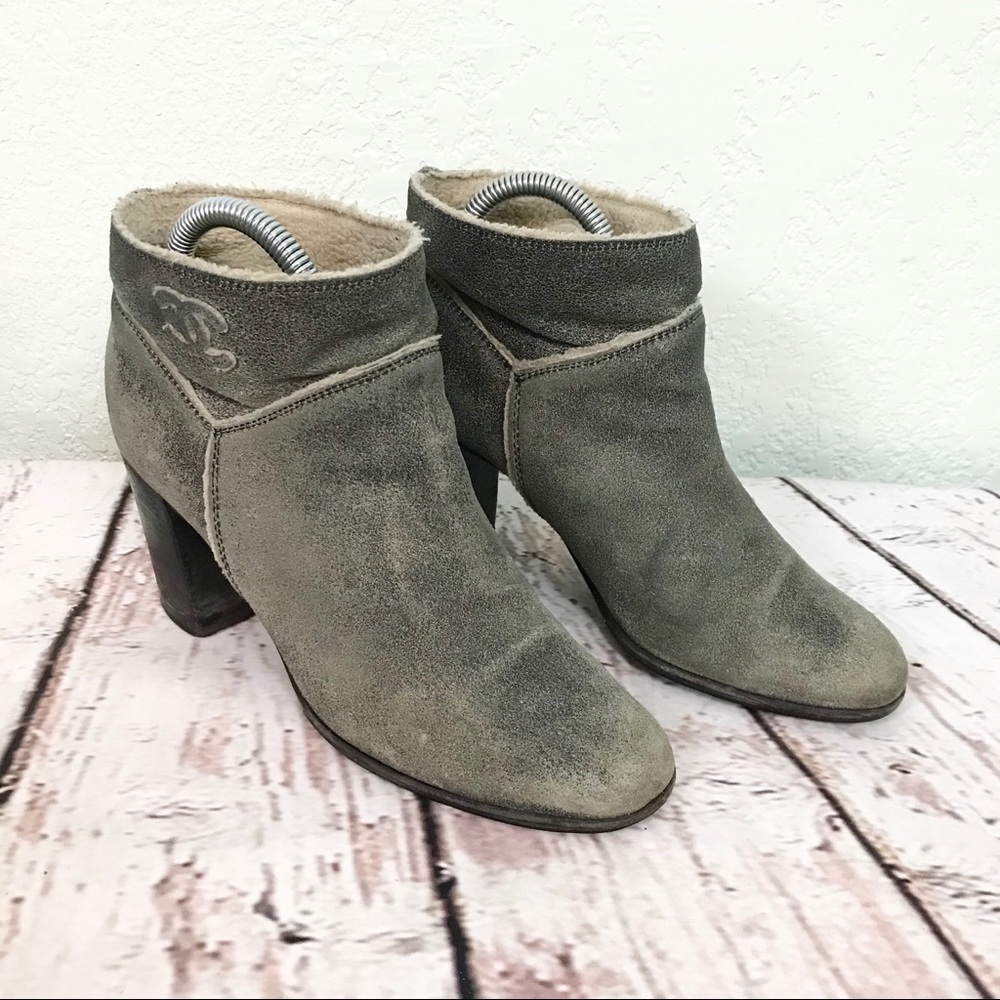 CHANEL distressed leather shearling ankle booties